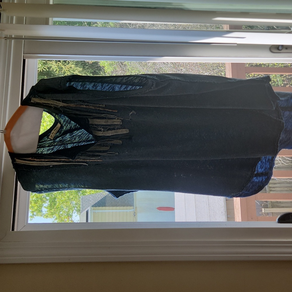 Free people oversized blue tank top with accent by collar.